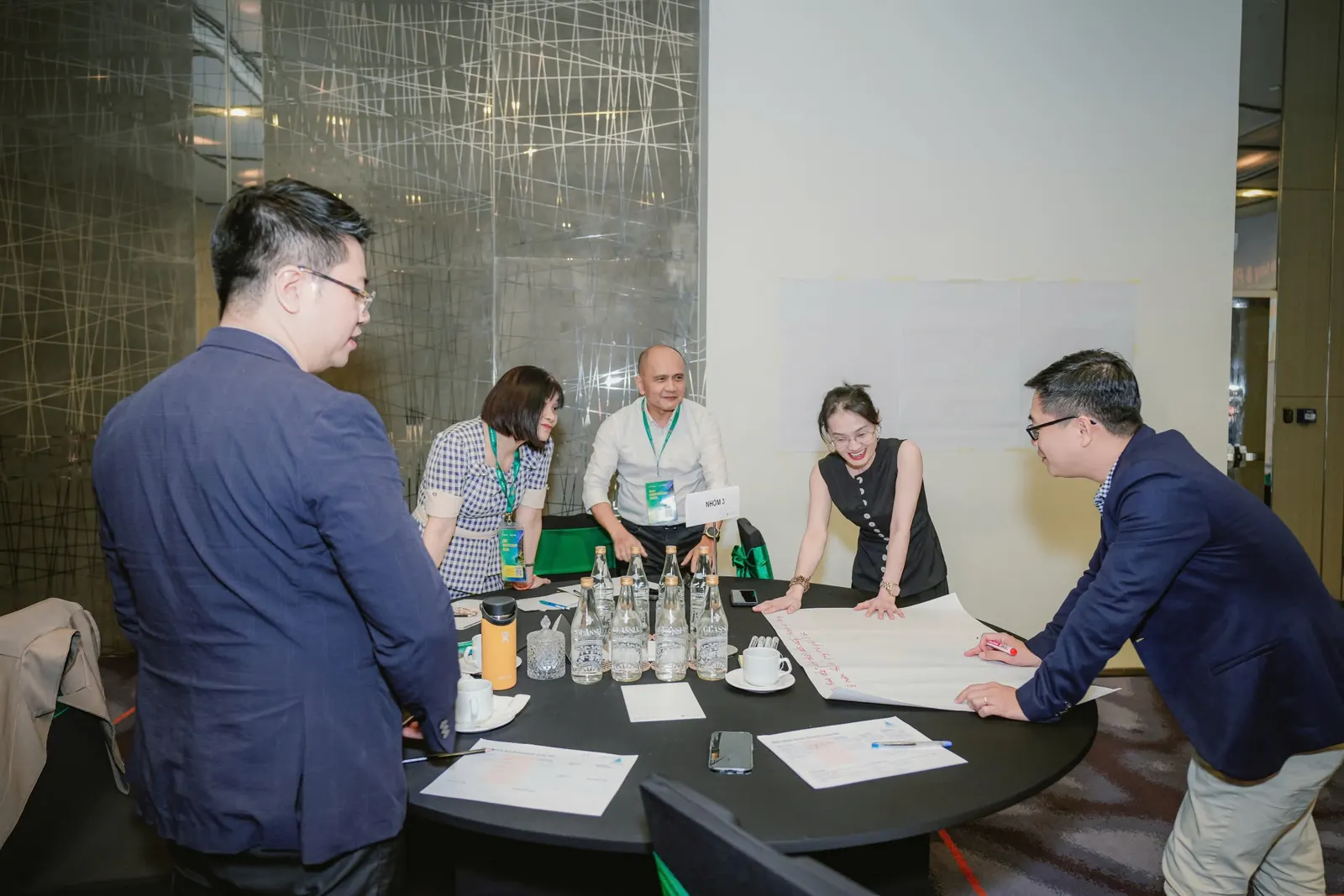 CEOs in group discussion around a round table during a CEO Bootcamp 2026 module